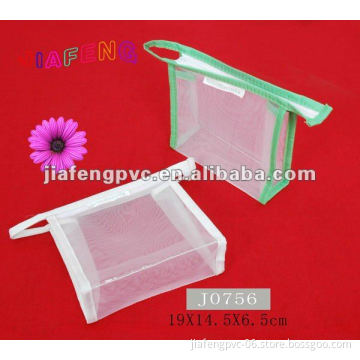 Mesh cosmetic bag with fabric binding and zipper